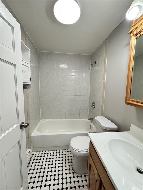 full bath featuring toilet, shower / bathing tub combination, and vanity