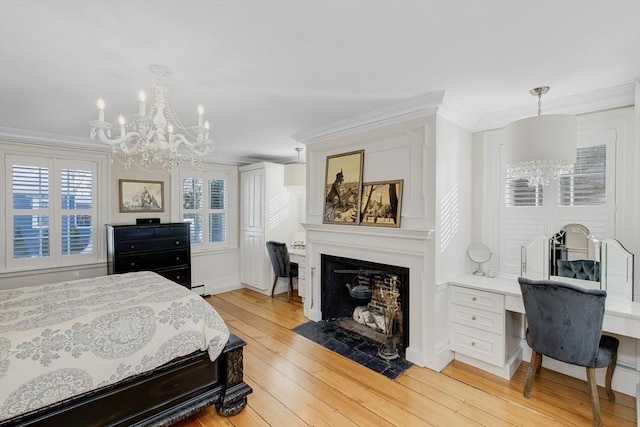 bedroom featuring crown molding, a chandelier, built in desk, baseboard heating, and light hardwood / wood-style floors