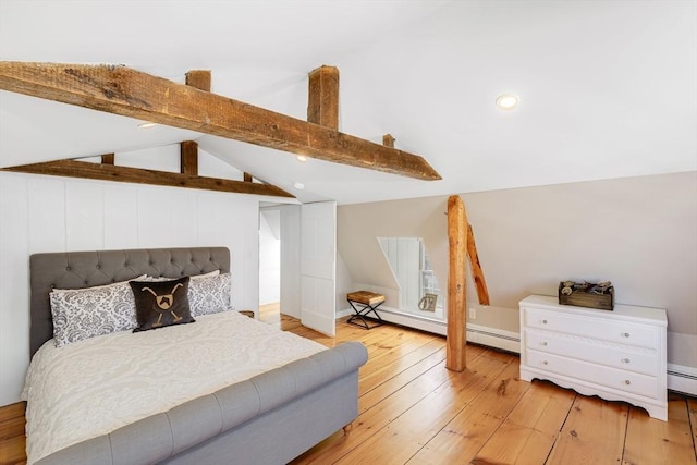 bedroom with lofted ceiling with beams and light hardwood / wood-style flooring