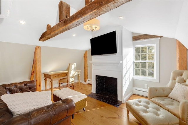 living room featuring baseboard heating, a chandelier, lofted ceiling with beams, and light wood-type flooring