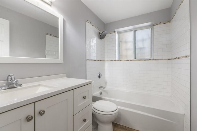 bathroom featuring shower / bath combination, toilet, vanity, and wood finished floors