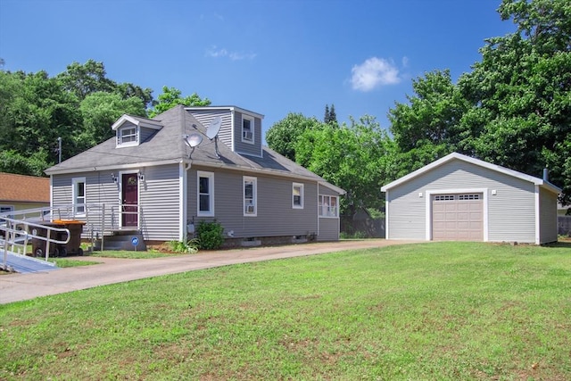 view of front of house with an outbuilding, a front lawn, and a garage