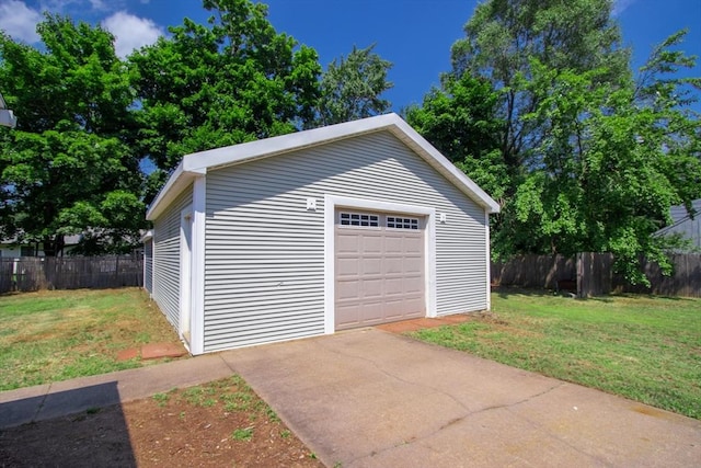 garage featuring a yard