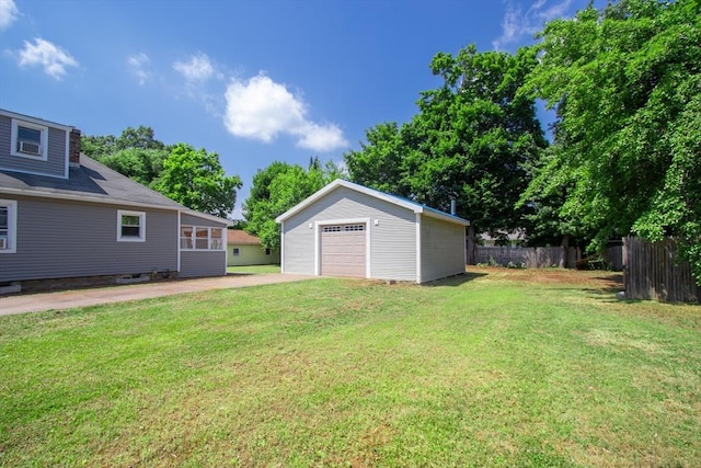 view of yard featuring a garage and an outdoor structure