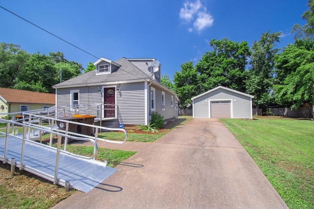 bungalow-style house with an outbuilding, a garage, and a front yard