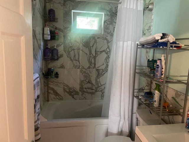 full bathroom featuring toilet, shower / tub combo, and vanity