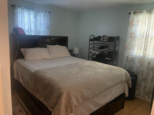 bedroom with hardwood / wood-style floors