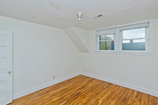 bonus room with hardwood / wood-style floors