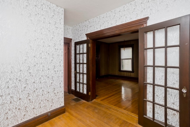 hall with wood-type flooring