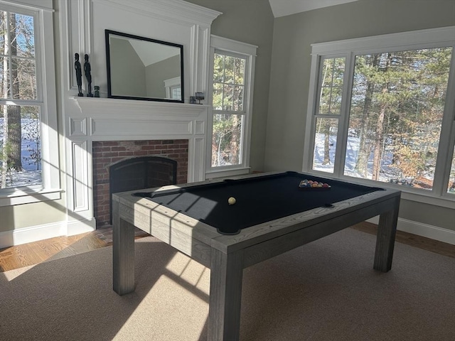 playroom with pool table, baseboards, vaulted ceiling, a fireplace, and wood finished floors