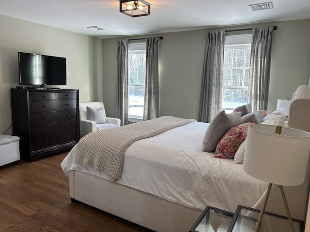 bedroom featuring dark wood-type flooring and visible vents