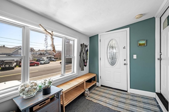 67 N End Blvd Unit 1, Salisbury, MA 01952 - foyer with lofted ceiling, carpet floors, and baseboards