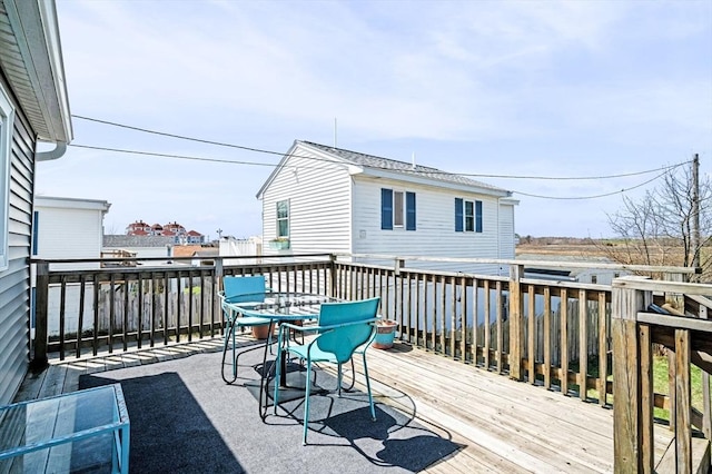 67 N End Blvd Unit 1, Salisbury, MA 01952 - wooden deck with outdoor dining area