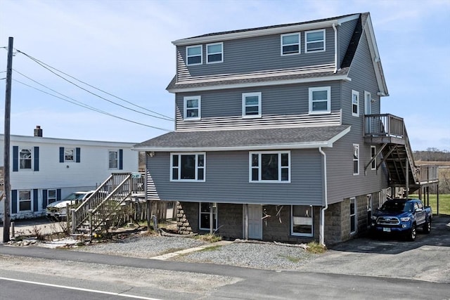 67 N End Blvd Unit 1, Salisbury, MA 01952 - coastal inspired home with stairs, asphalt driveway, and a shingled roof