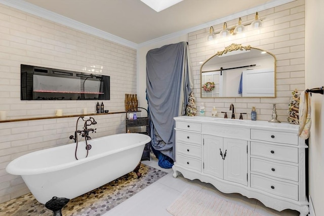 bathroom with tile patterned floors, vanity, ornamental molding, and a tub