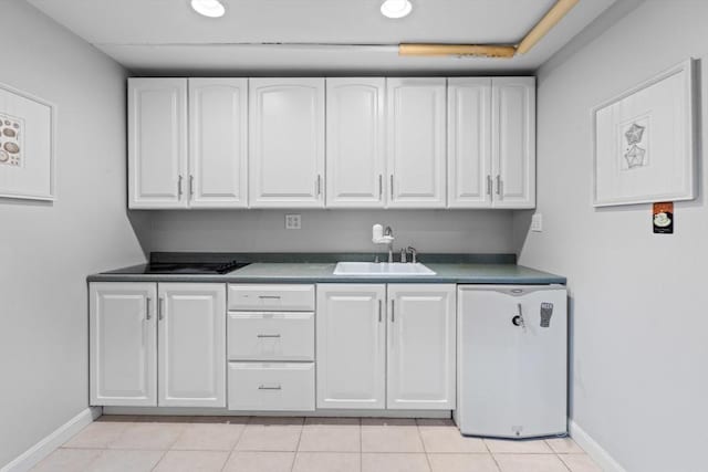32 Oneida Rd, Winchester, MA 01890 - kitchen featuring white cabinetry, dark countertops, light tile patterned flooring, and recessed lighting