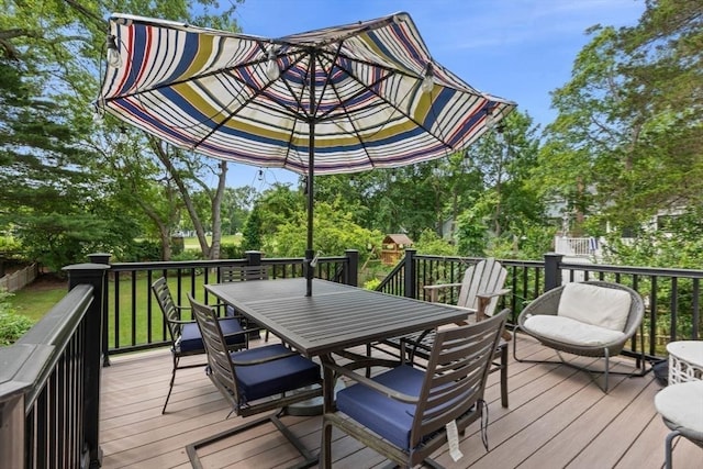 32 Oneida Rd, Winchester, MA 01890 - deck featuring outdoor dining area and view of scattered trees