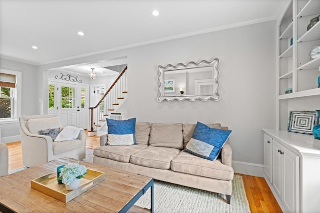 32 Oneida Rd, Winchester, MA 01890 - living room with ornamental molding, stairs, light wood-type flooring, and recessed lighting