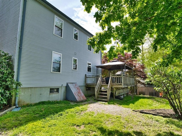 56 Gatehouse Dr, Fall River, MA 02720 - rear view of property with a wooden deck and a gazebo