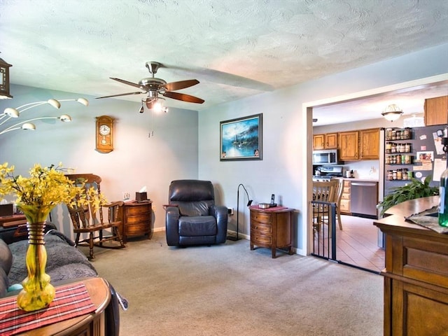 56 Gatehouse Dr, Fall River, MA 02720 - living area with a ceiling fan, light carpet, a textured ceiling, and baseboards