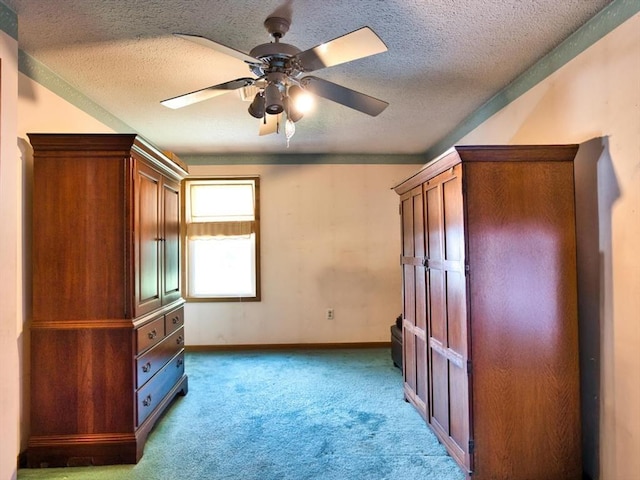 56 Gatehouse Dr, Fall River, MA 02720 - unfurnished bedroom with carpet flooring, a textured ceiling, baseboards, and a ceiling fan