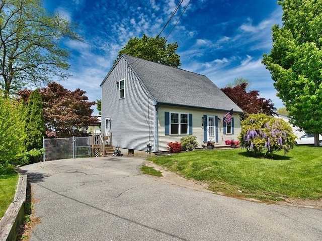 56 Gatehouse Dr, Fall River, MA 02720 - view of front of property with driveway, a shingled roof, and a front yard
