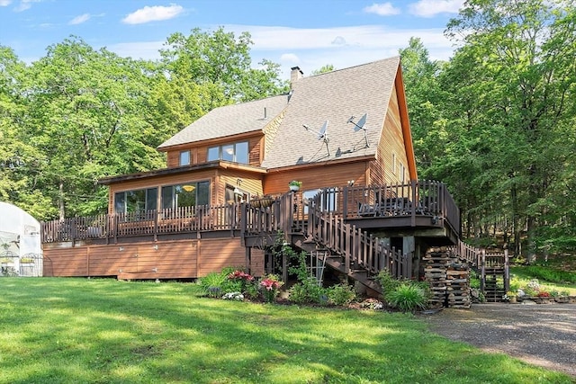 421 Legate Hill Rd, Charlemont, MA 01339 - back of property with stairs, a yard, a deck, roof with shingles, and a chimney