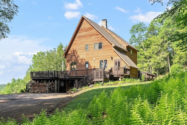421 Legate Hill Rd, Charlemont, MA 01339 - rear view of house with a wooden deck, a chimney, and stairway