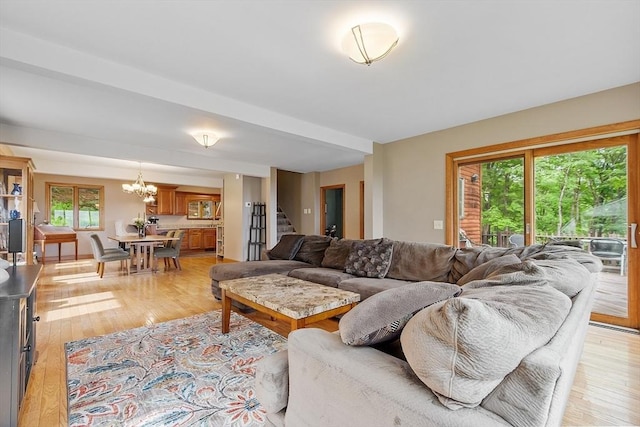 421 Legate Hill Rd, Charlemont, MA 01339 - living room with stairs, a chandelier, and light wood finished floors