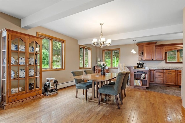 421 Legate Hill Rd, Charlemont, MA 01339 - dining room with light wood-style floors, a chandelier, and a baseboard heating unit