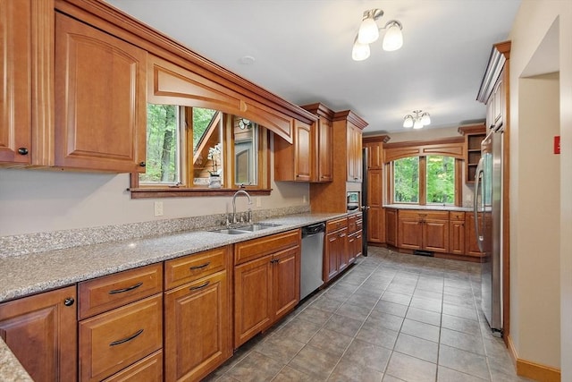 421 Legate Hill Rd, Charlemont, MA 01339 - kitchen with stainless steel appliances, brown cabinets, light stone countertops, and tile patterned flooring