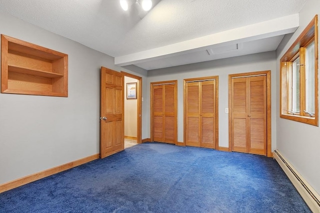 421 Legate Hill Rd, Charlemont, MA 01339 - unfurnished bedroom with baseboard heating, two closets, and carpet floors