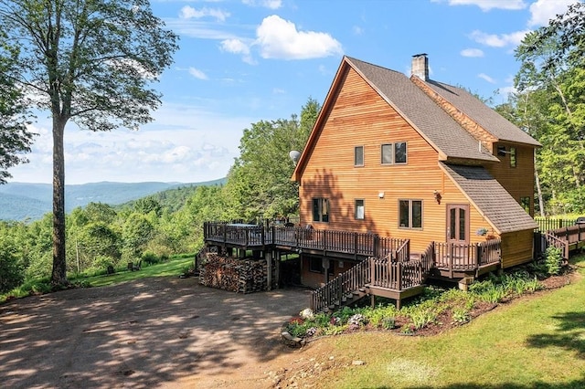 421 Legate Hill Rd, Charlemont, MA 01339 - back of house with a wooden deck, a chimney, roof with shingles, and stairs