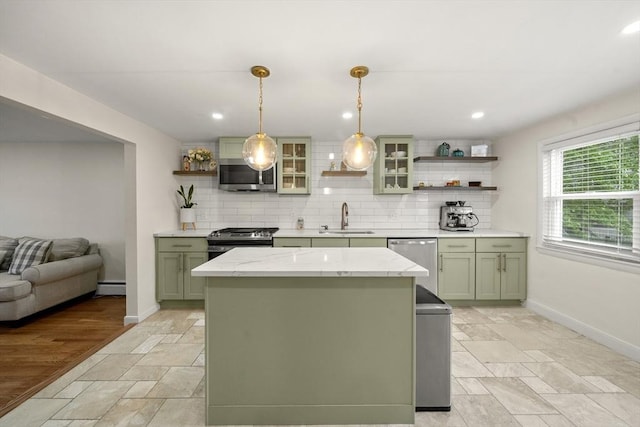 kitchen featuring appliances with stainless steel finishes, green cabinetry, open shelves, a sink, and recessed lighting