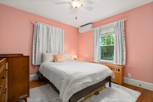 26 Edgebrook Rd, Boston, MA 02132 - bedroom with a wall mounted air conditioner, wood finished floors, and a ceiling fan