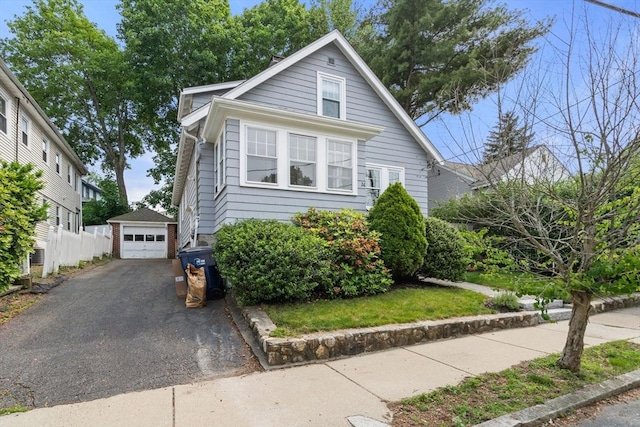 26 Edgebrook Rd, Boston, MA 02132 - bungalow-style house featuring asphalt driveway, an outbuilding, and a garage