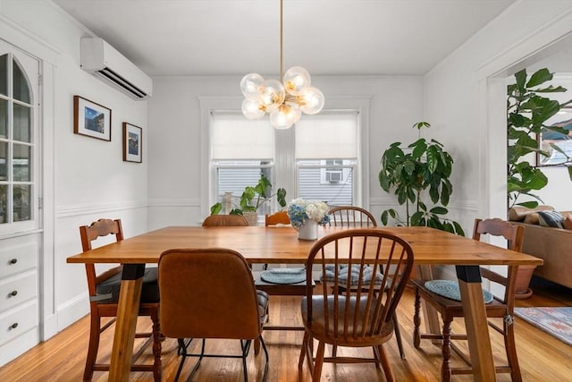 26 Edgebrook Rd, Boston, MA 02132 - dining space with a wall unit AC, light wood-type flooring, and a chandelier