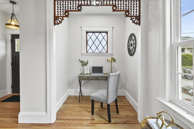 office space featuring wood finished floors and baseboards