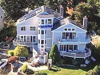 rear view of house with a balcony