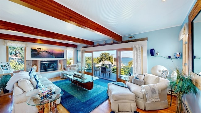 living room featuring beamed ceiling and wood-type flooring