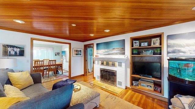 living room featuring built in features, wooden ceiling, and wood finished floors