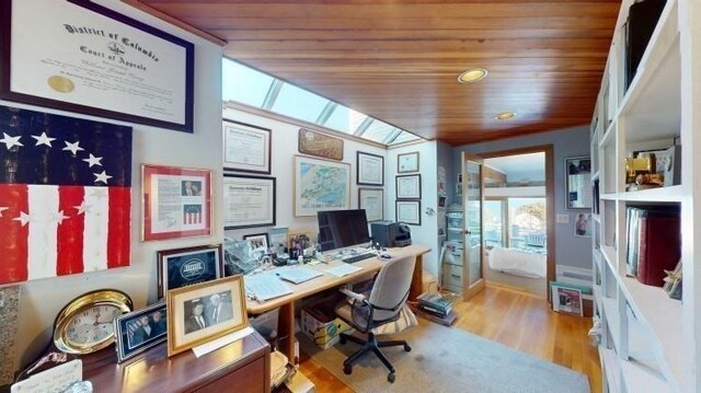 office area with wooden ceiling and light hardwood / wood-style flooring