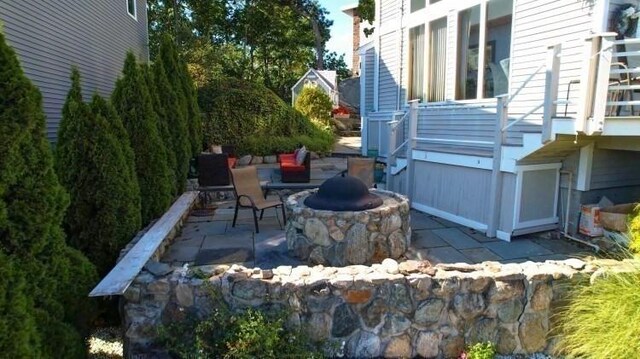 view of patio / terrace with a fire pit