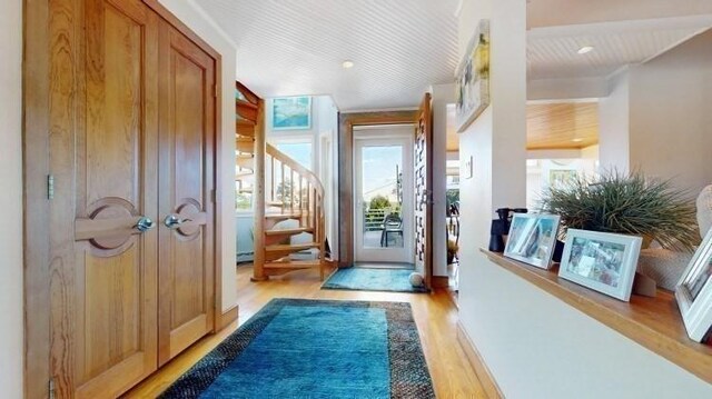 foyer entrance with light hardwood / wood-style flooring