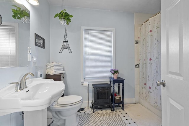 bathroom with tile patterned flooring, toilet, sink, and a shower with shower curtain