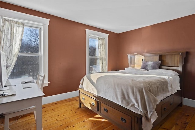 bedroom with wood-type flooring