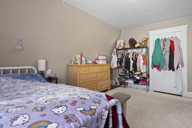 carpeted bedroom with lofted ceiling