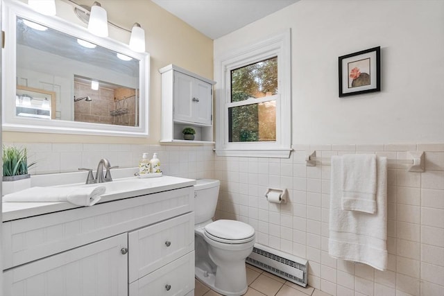 41 Harvey Ln, Westborough, MA 01581 - full bathroom featuring a baseboard radiator, tile walls, vanity, a tile shower, and tile patterned flooring