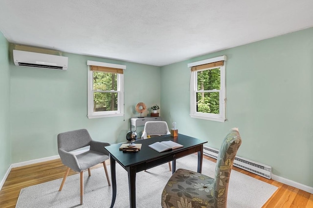 41 Harvey Ln, Westborough, MA 01581 - office area with a wall mounted air conditioner, wood finished floors, plenty of natural light, and baseboard heating