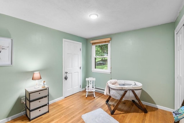 41 Harvey Ln, Westborough, MA 01581 - sitting room featuring light wood-style flooring and a baseboard heating unit